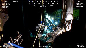 screen grab showing ROV arm and IGT sampler at Deepwater Horizon wellhead