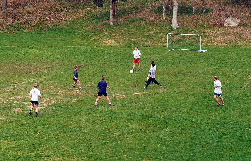 WHOI employees and students play a lunchtime soccer match. (Woods Hole Oceanographic Institution)