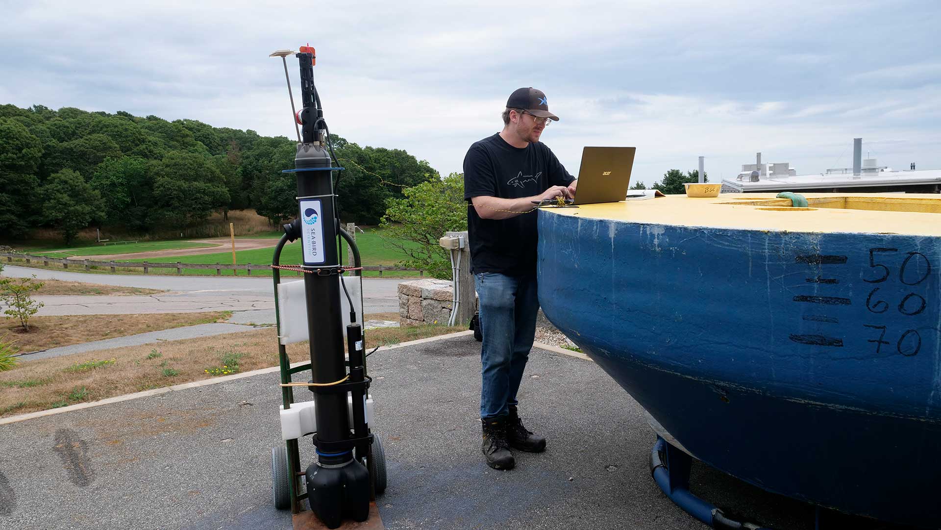 WHOI engineer Bill Dullea with one of the autonomous profiling floats that WHOI will help deploy in the Atlantic Ocean as part of the GO-BGC Array. (Photo by Ken Kostel, ©Woods Hole Oceanographic Institution)